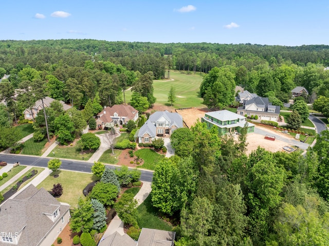 birds eye view of property featuring a residential view and a forest view