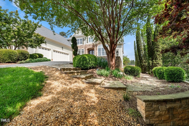 view of front of property featuring an attached garage and driveway
