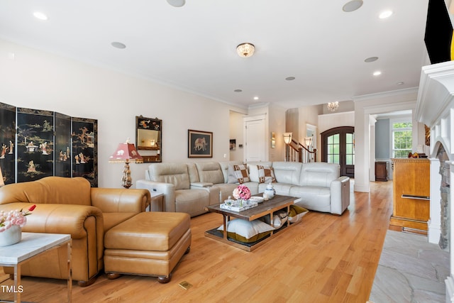 living area with stairway, recessed lighting, ornamental molding, and light wood finished floors