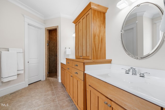 bathroom with crown molding, tile patterned flooring, visible vents, vanity, and a stall shower