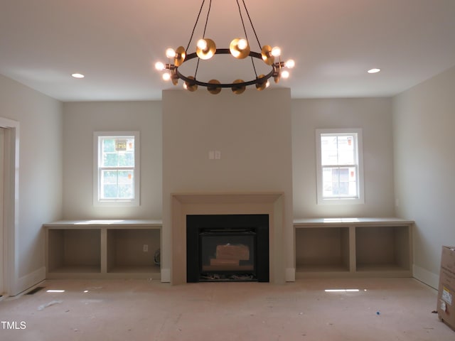 2590 Silas Peak Ln, Apex, NC 27523 - unfurnished living room featuring a chandelier, a fireplace, and recessed lighting