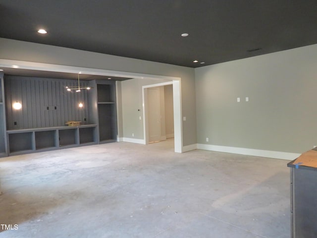2590 Silas Peak Ln, Apex, NC 27523 - unfurnished living room featuring concrete floors and recessed lighting