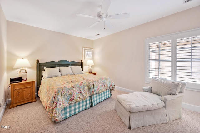 bedroom featuring carpet floors, a ceiling fan, baseboards, and visible vents
