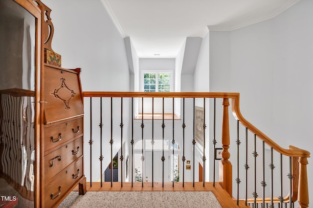 stairway featuring ornamental molding