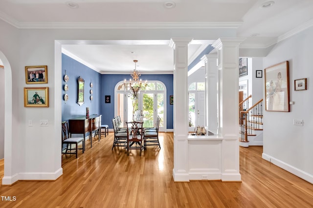 dining space with baseboards, plenty of natural light, and light wood-style flooring