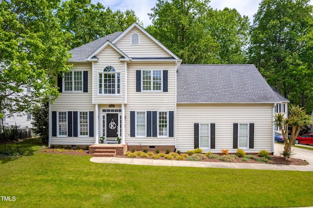 8600 Clivedon Dr, Raleigh, NC 27615 - colonial inspired home featuring a shingled roof, a front lawn, and crawl space
