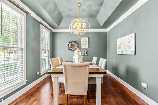 8600 Clivedon Dr, Raleigh, NC 27615 - dining space featuring baseboards, a raised ceiling, a chandelier, and dark wood-style floors