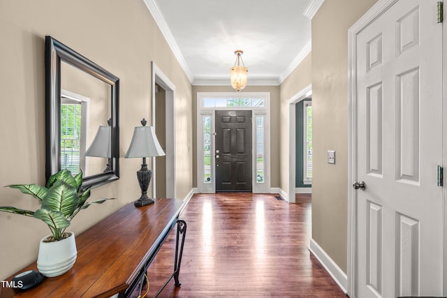 8600 Clivedon Dr, Raleigh, NC 27615 - foyer featuring baseboards, ornamental molding, and wood finished floors
