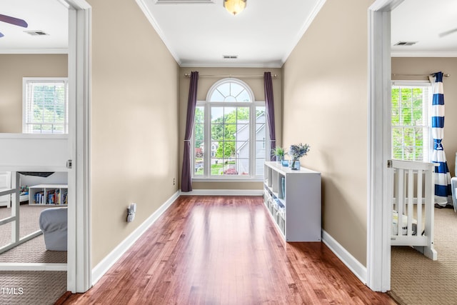 8600 Clivedon Dr, Raleigh, NC 27615 - doorway with visible vents, wood finished floors, and a wealth of natural light