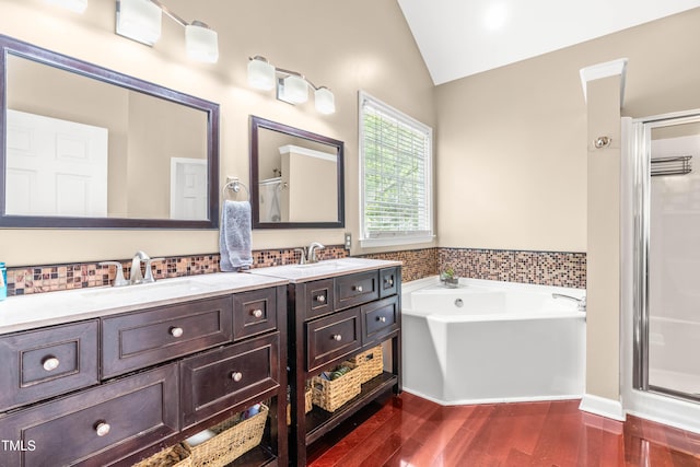 8600 Clivedon Dr, Raleigh, NC 27615 - bathroom with double vanity, a shower stall, a sink, and lofted ceiling