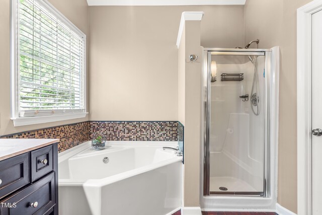8600 Clivedon Dr, Raleigh, NC 27615 - bathroom with a shower stall, a garden tub, and vanity