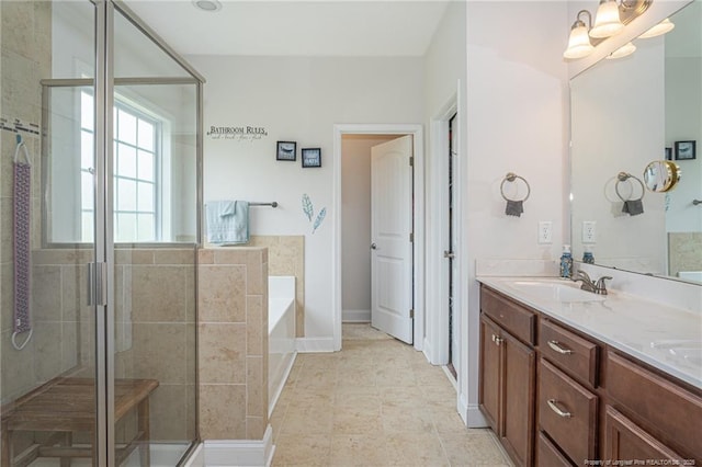8220 Rivermist Ln, Linden, NC 28356 - bathroom featuring a sink, a bath, a stall shower, double vanity, and tile patterned flooring