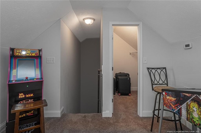 8220 Rivermist Ln, Linden, NC 28356 - rec room with a textured ceiling, lofted ceiling, and carpet floors