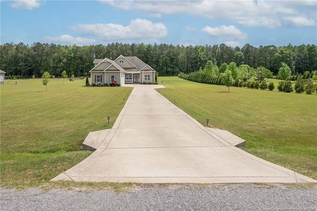 8220 Rivermist Ln, Linden, NC 28356 - view of front facade featuring a forest view, a front yard, and concrete driveway