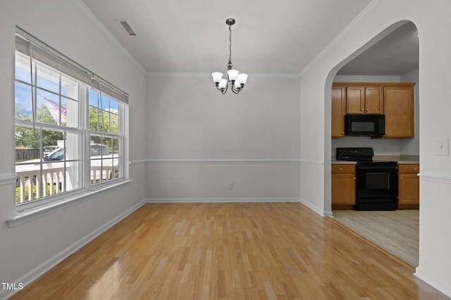 unfurnished dining area with a chandelier, arched walkways, visible vents, and light wood-type flooring