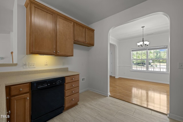 kitchen featuring light countertops, a chandelier, brown cabinets, arched walkways, and dishwasher