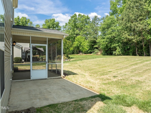 view of yard featuring a patio and a sunroom