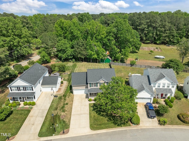 bird's eye view featuring a forest view