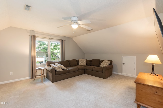 living room featuring lofted ceiling, ceiling fan, baseboards, and light colored carpet