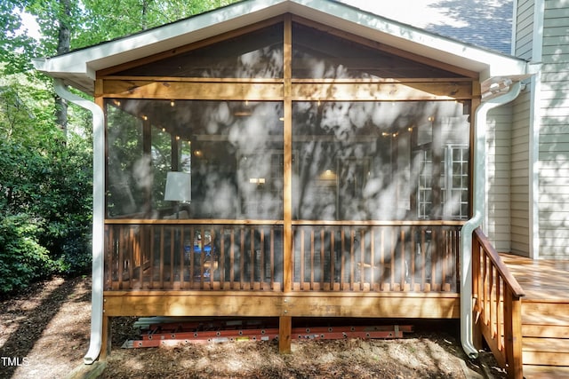 view of outbuilding with a sunroom