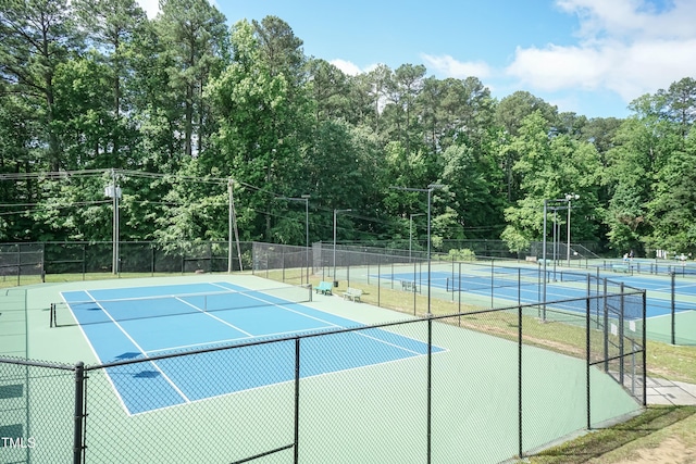 view of tennis court with fence