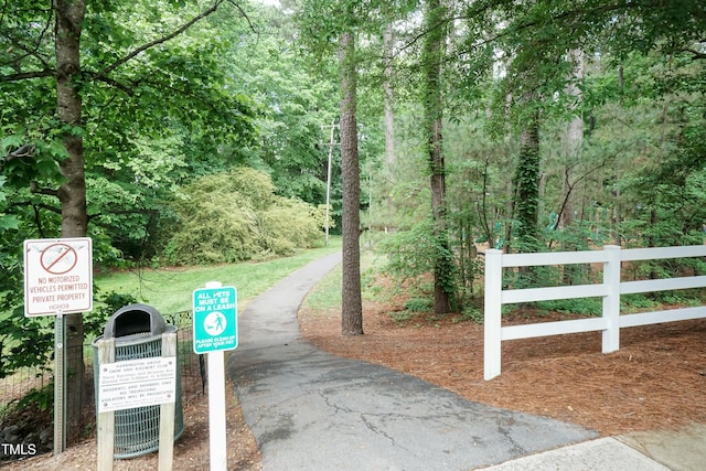 view of property's community featuring fence