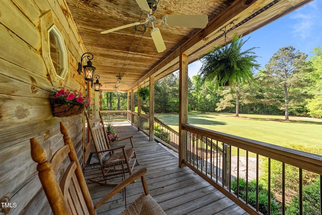 407 Howard Tant Rd, Zebulon, NC 27597 - wooden deck with a lawn, a ceiling fan, and covered porch
