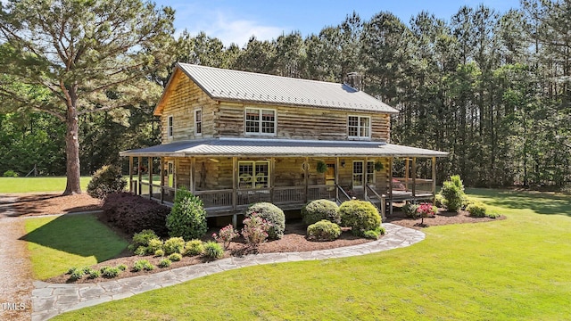 407 Howard Tant Rd, Zebulon, NC 27597 - exterior space with a porch, a front lawn, log exterior, and metal roof
