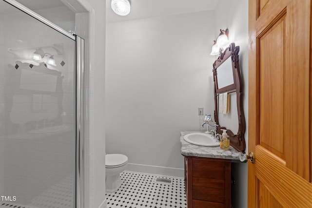 407 Howard Tant Rd, Zebulon, NC 27597 - full bath with vanity, baseboards, toilet, and a shower stall