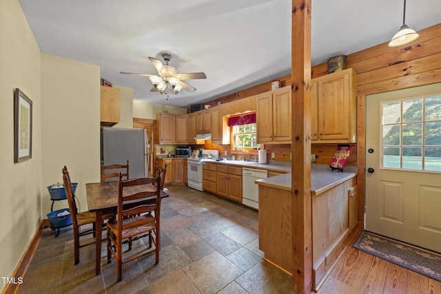 407 Howard Tant Rd, Zebulon, NC 27597 - kitchen with ceiling fan, light countertops, a sink, a peninsula, and white appliances