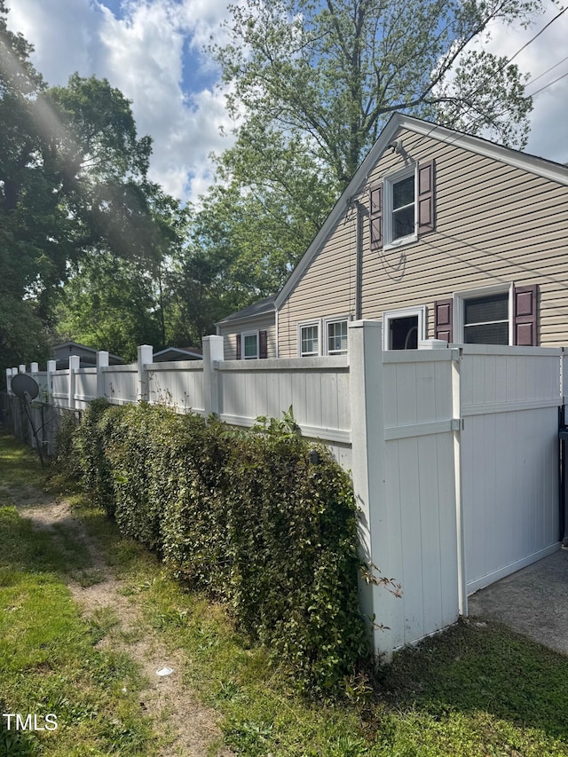 view of property exterior featuring fence
