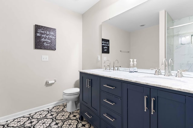 513 Commons Dr, Holly Springs, NC 27540 - full bathroom featuring baseboards, a sink, double vanity, and toilet
