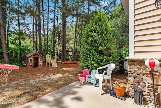 513 Commons Dr, Holly Springs, NC 27540 - view of patio / terrace featuring a playground