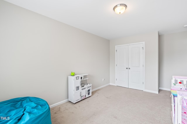 513 Commons Dr, Holly Springs, NC 27540 - recreation room with light colored carpet and baseboards