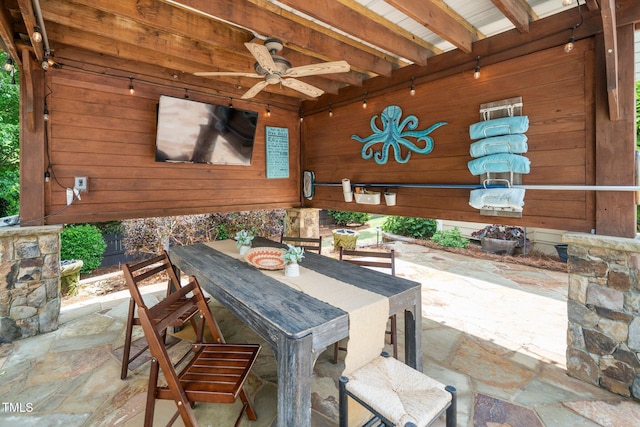view of patio featuring a ceiling fan and outdoor dining area