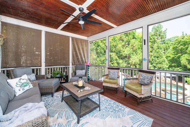 sunroom featuring ceiling fan, outdoor lounge area, and plenty of natural light