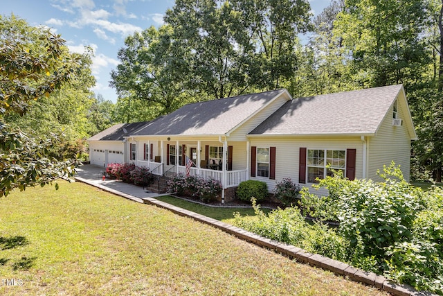 rear view of house featuring a porch, roof with shingles, concrete driveway, a garage, and a lawn