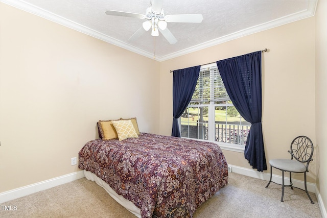 carpeted bedroom with crown molding, a textured ceiling, baseboards, and ceiling fan