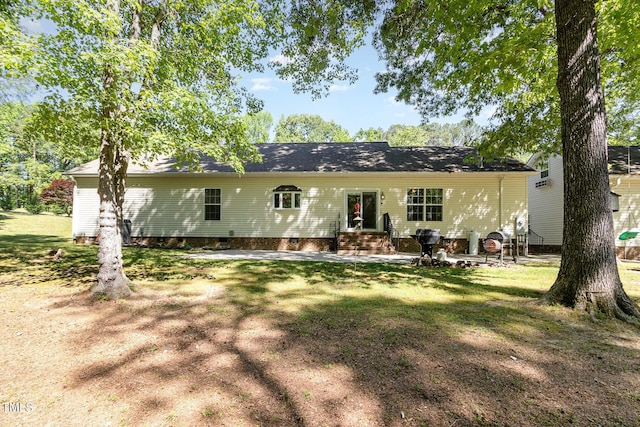 view of front of property with a front lawn and crawl space