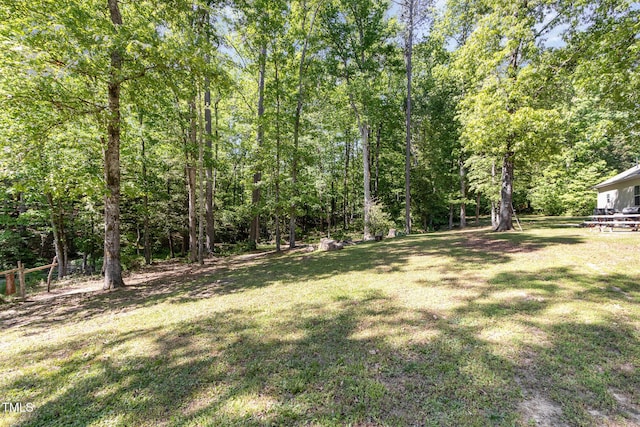 view of yard with a wooded view