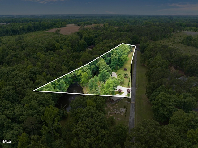 bird's eye view featuring a wooded view