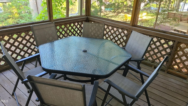 sunroom with outdoor dining area