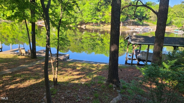 exterior space featuring a water view and boat lift