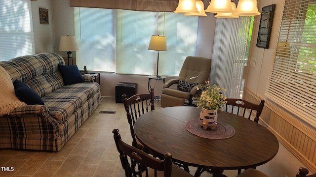 dining room with tile patterned flooring and baseboards