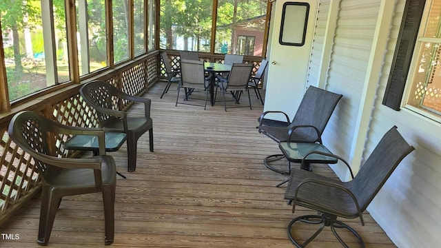 sunroom / solarium with outdoor dining area