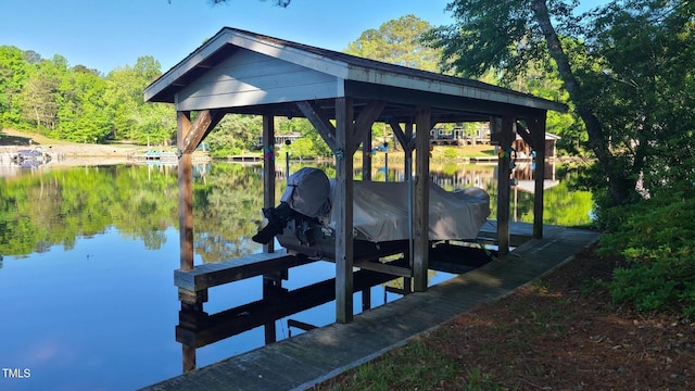 view of dock featuring boat lift and a water view
