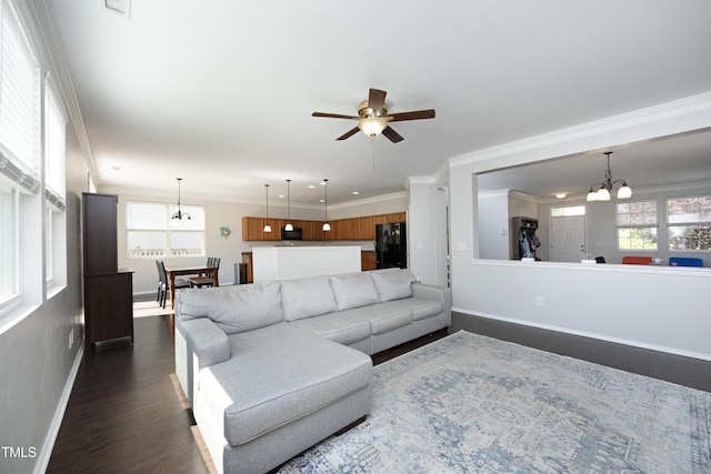 621 Childsberg Way, Hillsborough, NC 27278 - living room with crown molding, dark wood finished floors, ceiling fan with notable chandelier, baseboards, and visible vents