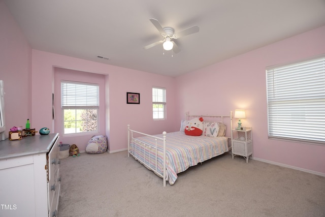 621 Childsberg Way, Hillsborough, NC 27278 - bedroom featuring baseboards, a ceiling fan, light carpet, and multiple windows