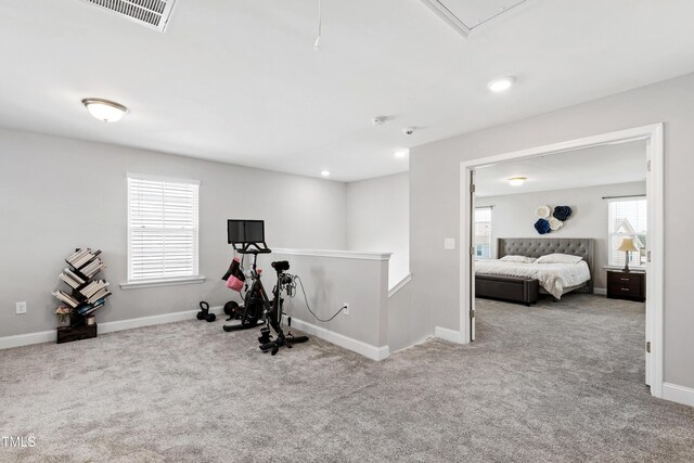 147 Antler Steel Dr, Clayton, NC 27527 - exercise area featuring visible vents, carpet flooring, baseboards, and attic access