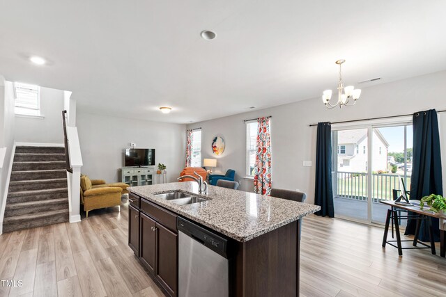 147 Antler Steel Dr, Clayton, NC 27527 - kitchen featuring dark brown cabinets, a sink, dishwasher, plenty of natural light, and open floor plan